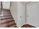 Modern staircase with dark wood steps, and a metal handrail at 2050 W Warm Springs Rd # 1822, Henderson, NV 89014