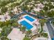 Aerial shot of community tennis courts surrounded by palm trees and residences, offering a vibrant recreational space at 2050 W Warm Springs Rd # 1822, Henderson, NV 89014
