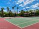 Well-maintained community tennis courts surrounded by lush landscaping and palm trees at 2050 W Warm Springs Rd # 1822, Henderson, NV 89014