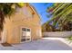 Backyard with patio space, landscaping, and the house's rear elevation at 2105 Harbor Cliff Dr, Las Vegas, NV 89128