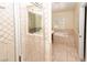 Inviting bathroom with a glass enclosed shower and a soaking tub under a window at 2105 Harbor Cliff Dr, Las Vegas, NV 89128