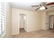 Bedroom featuring neutral walls, ceiling fan, walk-in closet, and carpeted flooring at 2105 Harbor Cliff Dr, Las Vegas, NV 89128