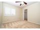 Bedroom featuring neutral walls, ceiling fan, bright window shutters, and carpeted flooring at 2105 Harbor Cliff Dr, Las Vegas, NV 89128