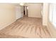 Large bedroom featuring neutral walls, carpeted flooring, ceiling fan, and bright window shutters at 2105 Harbor Cliff Dr, Las Vegas, NV 89128