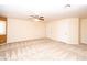 Large bedroom with neutral carpet, and multiple doors at 2105 Harbor Cliff Dr, Las Vegas, NV 89128