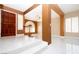 Bright entryway with white tile flooring, staircase, and decorative accents, creating a welcoming ambiance at 2105 Harbor Cliff Dr, Las Vegas, NV 89128