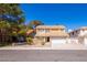 Charming two-story home featuring a well-maintained yard and attached two-car garage with a driveway at 2105 Harbor Cliff Dr, Las Vegas, NV 89128