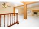 Expansive living area showcasing an open floor plan, modern finishes, fireplace, and staircase at 2105 Harbor Cliff Dr, Las Vegas, NV 89128
