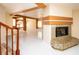 Inviting living room with a stone fireplace, open layout, and large windows for natural light at 2105 Harbor Cliff Dr, Las Vegas, NV 89128