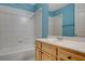 Bathroom featuring a white tiled shower-tub combination and a single vanity at 232 Morgyn Ln # 6, Boulder City, NV 89005