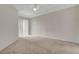 Spacious bedroom featuring neutral carpeting, ample natural light, and a ceiling fan at 232 Morgyn Ln # 6, Boulder City, NV 89005