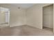 Bedroom with neutral carpet and access to additional rooms at 232 Morgyn Ln # 6, Boulder City, NV 89005