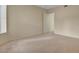 Bedroom with a view from the window and neutral carpeting at 232 Morgyn Ln # 6, Boulder City, NV 89005