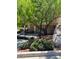 Two-story condo building with lush landscaping and mature trees at 232 Morgyn Ln # 6, Boulder City, NV 89005