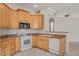 Well-lit kitchen with modern appliances and granite countertops at 232 Morgyn Ln # 6, Boulder City, NV 89005