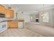 Open-concept living room adjacent to a kitchen featuring a fireplace and abundant natural light at 232 Morgyn Ln # 6, Boulder City, NV 89005