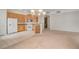 Bright kitchen with white appliances adjacent to a spacious living area at 232 Morgyn Ln # 6, Boulder City, NV 89005