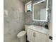 This bathroom features a white vanity, sleek marble countertop, modern fixtures and a backlit mirror at 2429 Worchester Rd, Henderson, NV 89074