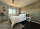 Bright bedroom with large window, accent wall, and plush carpet at 2429 Worchester Rd, Henderson, NV 89074