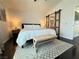 Serene primary bedroom with stylish accent wall and en-suite bathroom access at 2429 Worchester Rd, Henderson, NV 89074