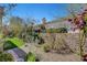 Lush backyard features a rock wall and artificial turf at 2505 Palmridge Dr, Las Vegas, NV 89134