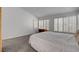 Spacious bedroom with ample natural light from window with bright white shutters at 2505 Palmridge Dr, Las Vegas, NV 89134