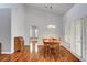 Dining room with a classic round table and hardwood floors, illuminated by a pendant light at 2505 Palmridge Dr, Las Vegas, NV 89134