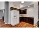 The open kitchen features dark cabinets, a refrigerator, and a stylish design at 2505 Palmridge Dr, Las Vegas, NV 89134