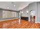 Spacious living room with hardwood floors, plantation shutters, and built-in cabinets at 2505 Palmridge Dr, Las Vegas, NV 89134