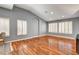 Bright living room with hardwood floors, plantation shutters, and an open archway at 2505 Palmridge Dr, Las Vegas, NV 89134