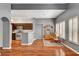Open-concept living space with hardwood floors, view into kitchen, and classic furniture at 2505 Palmridge Dr, Las Vegas, NV 89134