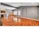 Open-concept living area with hardwood floors, open archway and view of the kitchen at 2505 Palmridge Dr, Las Vegas, NV 89134