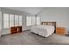 Bright main bedroom with a vaulted ceiling and plantation shutters that offer lots of natural light at 2505 Palmridge Dr, Las Vegas, NV 89134