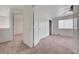 Bedroom featuring neutral carpet, closet, ceiling fan, and a view of the hall at 2612 Kindness Ct, North Las Vegas, NV 89031
