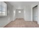 This simple bedroom has neutral carpet, is freshly painted, and includes a built in closet system at 2612 Kindness Ct, North Las Vegas, NV 89031
