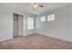 This cozy bedroom features a double closet, recessed lighting, and a ceiling fan at 2612 Kindness Ct, North Las Vegas, NV 89031