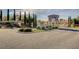 A gated entrance to the community with a guard house and manicured landscaping at 2612 Kindness Ct, North Las Vegas, NV 89031
