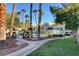 Community pool with lounge chairs and a grass area at 2612 Kindness Ct, North Las Vegas, NV 89031