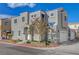 Corner lot home with a neutral exterior, well-maintained landscaping, and a two-car garage at 2612 Kindness Ct, North Las Vegas, NV 89031