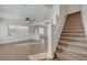 View of the light-filled living room with a staircase leading upstairs at 2612 Kindness Ct, North Las Vegas, NV 89031