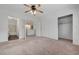 Main bedroom featuring neutral carpet, closet and a bathroom at 2612 Kindness Ct, North Las Vegas, NV 89031