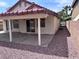 A covered patio and easy-care rock landscaping enhance this backyard, creating a private outdoor space at 3324 Haven Beach Way, Las Vegas, NV 89117