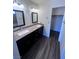 Bathroom featuring a granite countertop vanity and a glass door shower at 3324 Haven Beach Way, Las Vegas, NV 89117