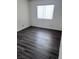 Bedroom featuring wood floors and a window with blinds at 3324 Haven Beach Way, Las Vegas, NV 89117