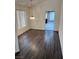 Cozy dining room with wood floors and large windows, perfect for Gathering meals at 3324 Haven Beach Way, Las Vegas, NV 89117