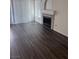 A spacious living room featuring wood floors and a cozy fireplace, ideal for relaxing and entertaining guests at 3324 Haven Beach Way, Las Vegas, NV 89117