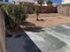 Backyard featuring desert landscaping, low maintenance, and a concrete patio for outdoor enjoyment at 3641 Spring Day Ct, Las Vegas, NV 89147
