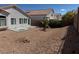 Backyard featuring desert landscaping, low maintenance, and a concrete patio for outdoor relaxation at 3641 Spring Day Ct, Las Vegas, NV 89147