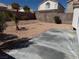 Spacious backyard with a concrete patio and desert landscaping for low maintenance and peaceful enjoyment at 3641 Spring Day Ct, Las Vegas, NV 89147