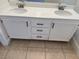 Bathroom vanity featuring double sinks, white cabinets, and black hardware at 3641 Spring Day Ct, Las Vegas, NV 89147